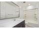 Bathroom featuring a vanity with a white countertop and combined tub and shower at 1081 E Armstrong Way, Chandler, AZ 85286