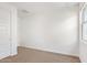 Bright bedroom with neutral carpet and a window for ample natural light at 1081 E Armstrong Way, Chandler, AZ 85286