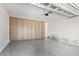 Attached garage includes storage cabinets, an automatic door opener, and epoxy flooring at 1081 E Armstrong Way, Chandler, AZ 85286