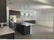 Bright, open kitchen with large island, ample cabinets, and modern pendant lighting at 1081 E Armstrong Way, Chandler, AZ 85286