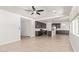Open-concept floor plan showcasing living and kitchen with tile flooring and stainless steel appliances at 1081 E Armstrong Way, Chandler, AZ 85286