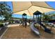 Playground showcasing slides and shaded picnic areas, offering a fun community gathering space at 1081 E Armstrong Way, Chandler, AZ 85286