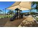 Community playground with shade canopies, slides, and benches, perfect for outdoor fun at 1081 E Armstrong Way, Chandler, AZ 85286