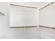 Walk-in closet with multiple shelves and rods for ample storage space at 1081 E Armstrong Way, Chandler, AZ 85286