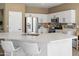 Bright kitchen with white cabinets, quartz countertops, and stainless steel appliances, offering a clean and modern aesthetic at 10909 W Chase Ln, Avondale, AZ 85323