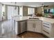 Modern kitchen with white countertops, stainless steel appliances, and an open layout, perfect for cooking and entertaining at 10909 W Chase Ln, Avondale, AZ 85323