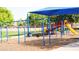 Community playground featuring swings and play structures with slides for outdoor activities at 10909 W Chase Ln, Avondale, AZ 85323