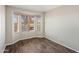 Bedroom featuring hard wood floors and natural light from the bay windows at 11049 N 111Th Way, Scottsdale, AZ 85259