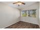 Bedroom with hard wood floors, ceiling fan and windows with blinds at 11049 N 111Th Way, Scottsdale, AZ 85259