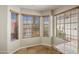 Cozy breakfast nook area featuring three windows, neutral paint, and tile flooring at 11049 N 111Th Way, Scottsdale, AZ 85259