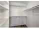 Walk-in closet with white shelving and hanging rods at 11049 N 111Th Way, Scottsdale, AZ 85259