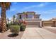 Beautiful two-story home featuring a Spanish tile roof, desert landscaping, and a two-car garage at 11049 N 111Th Way, Scottsdale, AZ 85259