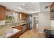 Kitchen showcasing granite countertops, stainless appliances, tile floors and a large window at 11049 N 111Th Way, Scottsdale, AZ 85259