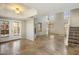 Bright living room with soaring ceilings, tiled floors, fireplace, and French doors leading to the outdoors at 11049 N 111Th Way, Scottsdale, AZ 85259