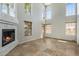 Spacious living room with a soaring ceiling, tiled floors, fireplace, and large windows at 11049 N 111Th Way, Scottsdale, AZ 85259