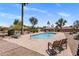 Sparkling pool surrounded by desert landscaping and lounge chairs at 11049 N 111Th Way, Scottsdale, AZ 85259