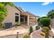 Stylish backyard featuring desert landscaping and a covered patio with a beautiful view at 11553 W Cottontail Ct, Surprise, AZ 85378