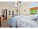 Bright bedroom featuring plush carpet, natural light, and a door to the outdoor area for easy access at 11553 W Cottontail Ct, Surprise, AZ 85378