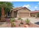 Inviting single-story home with desert landscaping and a two-car garage at 11553 W Cottontail Ct, Surprise, AZ 85378