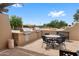 Outdoor kitchen featuring built-in grill and dining area, perfect for entertaining guests at 11553 W Cottontail Ct, Surprise, AZ 85378