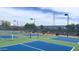Well-maintained pickleball court with professional netting and modern lighting at 11553 W Cottontail Ct, Surprise, AZ 85378