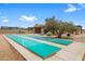 Recreational shuffleboard courts with meticulous landscaping and desert-style clubhouse at 11553 W Cottontail Ct, Surprise, AZ 85378