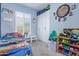Playful bedroom with vibrant decor, ample storage, and comfortable bedding creating an imaginative space at 12083 W Peak View Rd, Peoria, AZ 85383