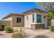 Single-story home with stone exterior and desert landscaping in a peaceful neighborhood at 12083 W Peak View Rd, Peoria, AZ 85383