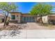 Charming single-story home featuring a brick driveway and desert landscaping at 12083 W Peak View Rd, Peoria, AZ 85383