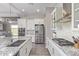 Well-equipped kitchen with stainless steel appliances, granite countertops, and ample cabinet space at 12083 W Peak View Rd, Peoria, AZ 85383