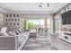 Cozy living room showcasing comfortable seating and access to the backyard at 12083 W Peak View Rd, Peoria, AZ 85383