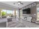Bright living room featuring large sliding doors to the backyard patio at 12083 W Peak View Rd, Peoria, AZ 85383