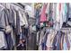 Organized walk-in closet with ample storage space and a safe for valuables, providing security and convenience at 12083 W Peak View Rd, Peoria, AZ 85383
