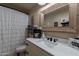 Bathroom features a modern sink, stylish fixtures, and decorative accents at 12238 W Patrick Ct, Sun City, AZ 85373