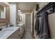 Bathroom with double sink vanity, stylish lighting, and modern design at 12238 W Patrick Ct, Sun City, AZ 85373