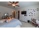 Bright bedroom with a view to the closet featuring a cozy bed, soft textures, and personal touches, adding warmth and character at 12238 W Patrick Ct, Sun City, AZ 85373
