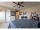 Bedroom featuring a ceiling fan, neutral walls, and cozy décor at 12238 W Patrick Ct, Sun City, AZ 85373
