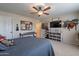 Bedroom featuring a bed, ceiling fan, and decor at 12238 W Patrick Ct, Sun City, AZ 85373