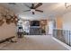 Bright bonus room with ceiling fan, built-in entertainment center and comfortable seating, ideal for relaxation and entertainment at 12238 W Patrick Ct, Sun City, AZ 85373