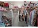 Walk-in closet with lots of storage and shelving at 12238 W Patrick Ct, Sun City, AZ 85373