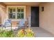 Cozy front porch with rocking chairs and welcoming decor at 12238 W Patrick Ct, Sun City, AZ 85373