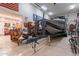 Spacious garage interior with room for boat and vehicle storage, alongside practical organization at 12238 W Patrick Ct, Sun City, AZ 85373