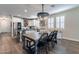 Bright kitchen with white cabinetry, stainless steel appliances and a large center island at 12238 W Patrick Ct, Sun City, AZ 85373