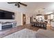 Spacious living room with a seamless transition to the kitchen and dining area at 12238 W Patrick Ct, Sun City, AZ 85373