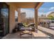 Charming covered patio with outdoor seating and built-in barbeque area for entertaining at 12238 W Patrick Ct, Sun City, AZ 85373