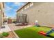 Spacious backyard with artificial turf, patio, trampoline, and play structures at 13380 N 148Th Ave, Surprise, AZ 85379