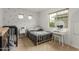 A charming bedroom with floral wallpaper, a vanity, and a comfortable-looking bed at 13380 N 148Th Ave, Surprise, AZ 85379