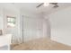 Cozy bedroom with plush carpet, window views, and large closet at 13380 N 148Th Ave, Surprise, AZ 85379