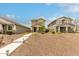 Charming two-story home with manicured front yard and inviting walkway at 13380 N 148Th Ave, Surprise, AZ 85379