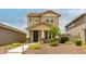 Attractive two-story home with a landscaped front yard and a welcoming entryway at 13380 N 148Th Ave, Surprise, AZ 85379